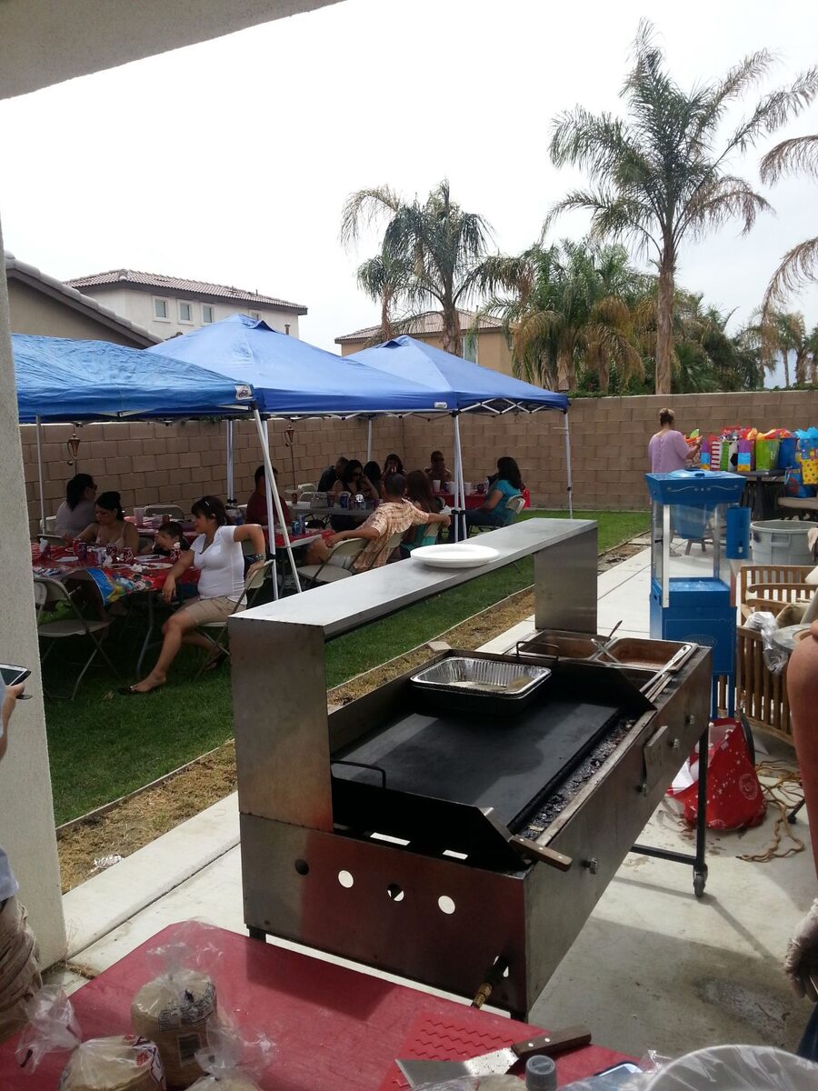 Taco catering cart set up outdoors in the sun