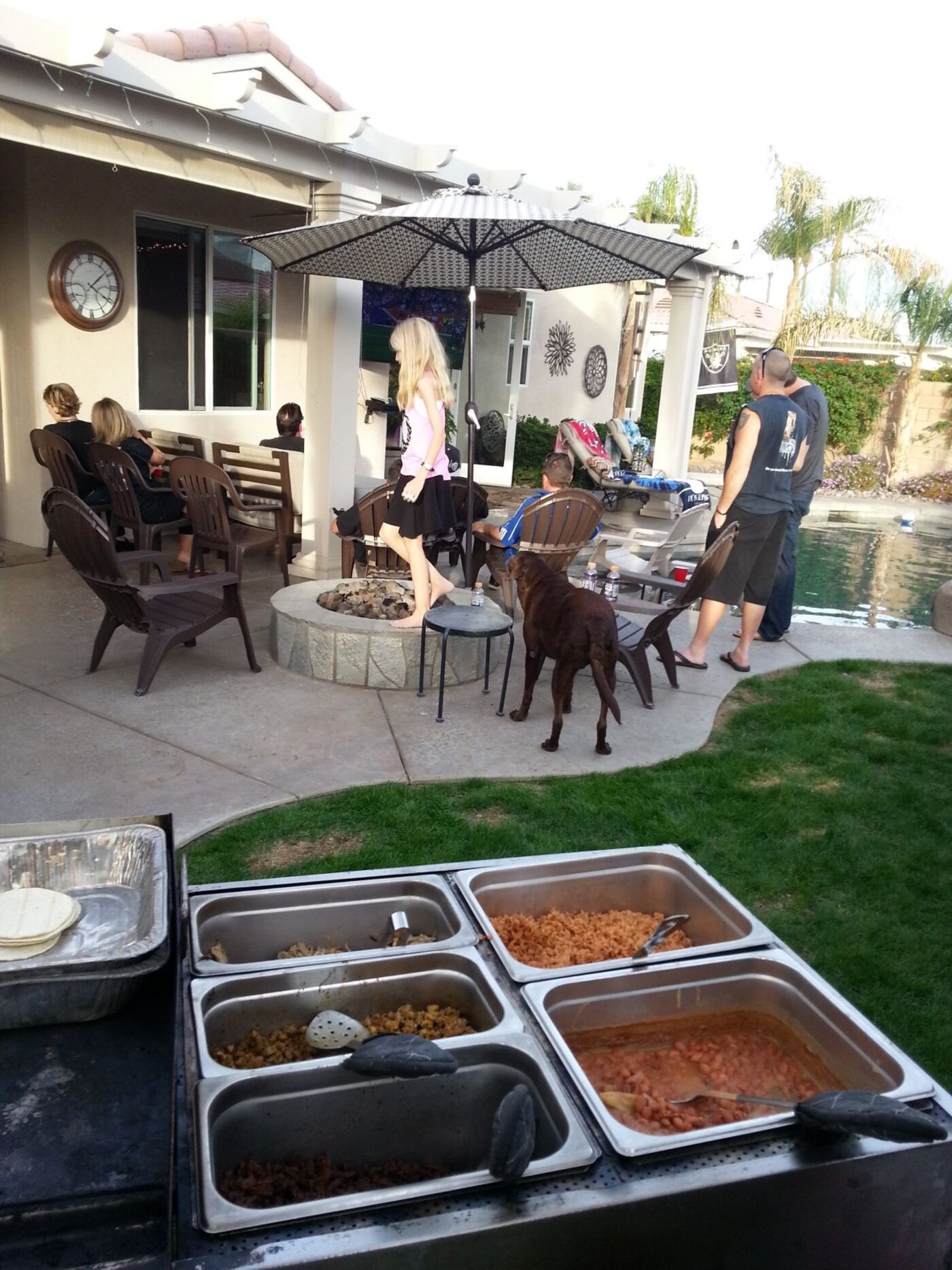 Guests being served at a taco catering event