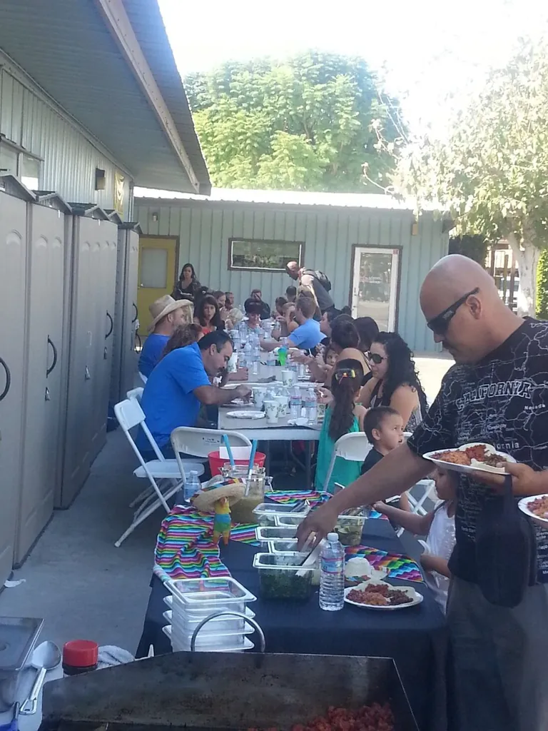 Taco caterer cooking on the grill at an event