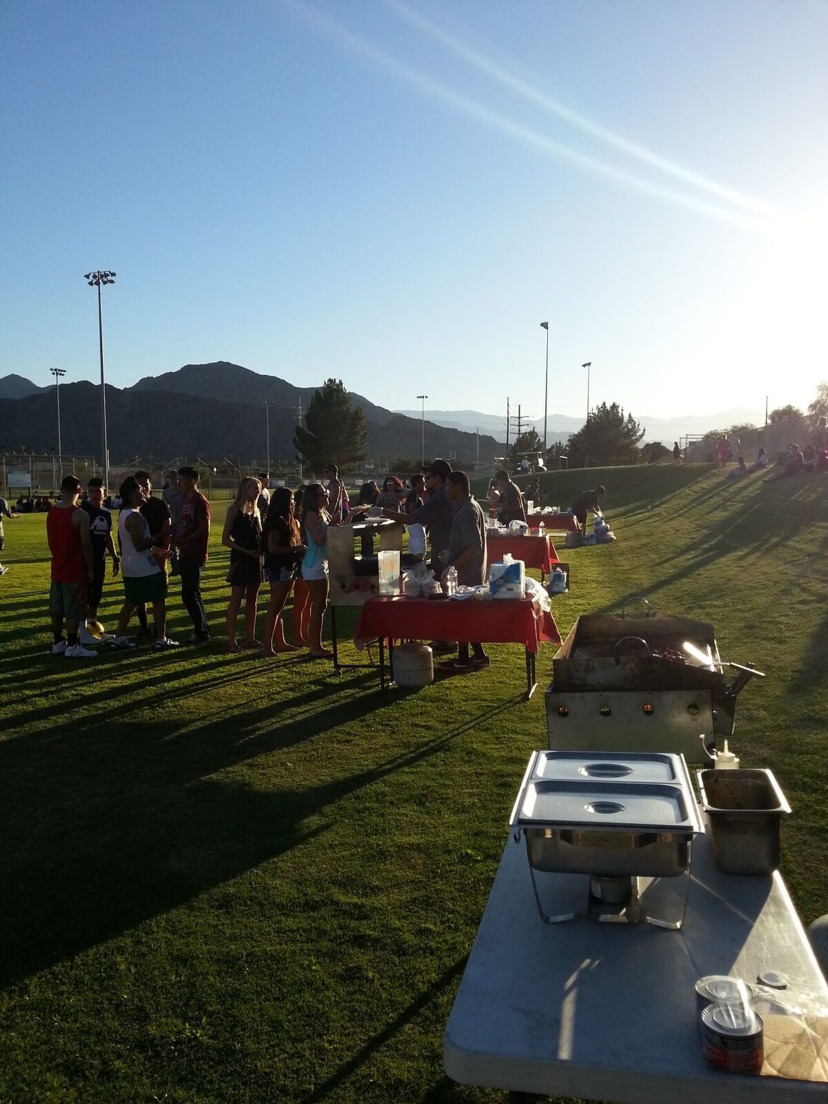 Taco catering event with a crowd and mountains behind